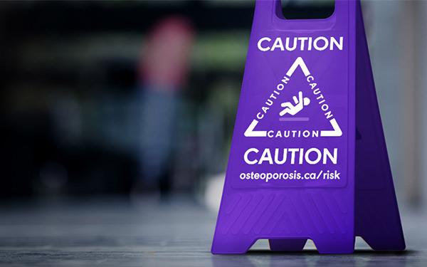 Purple wet floor caution sign