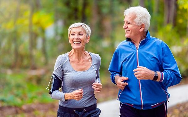 Older man and woman running