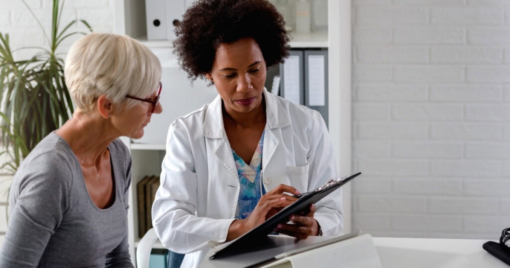 Doctor speaking to patient