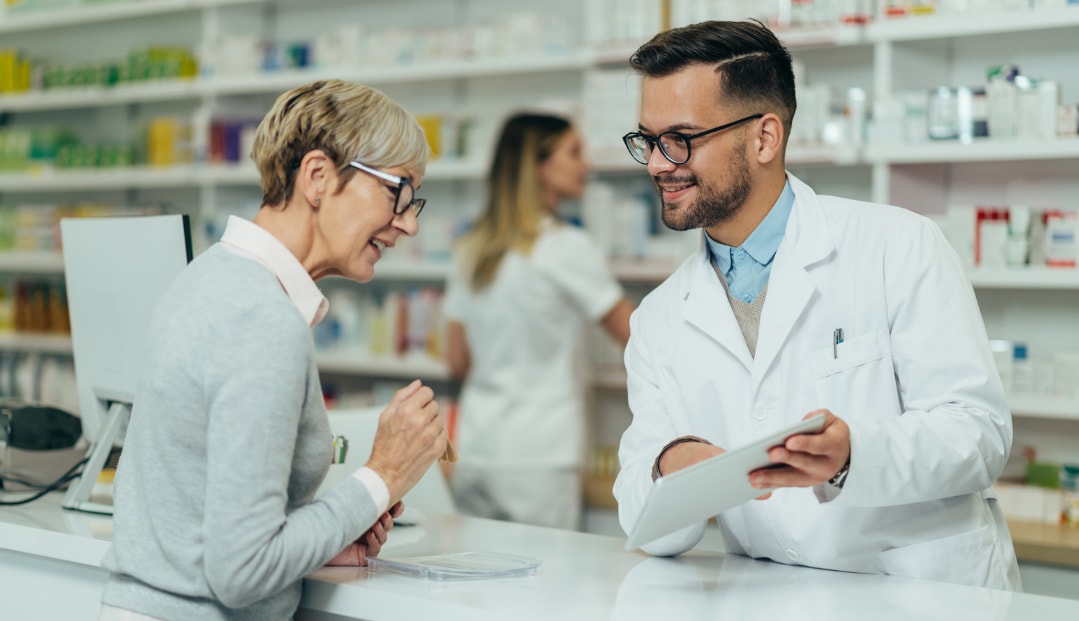 Pharmacist talking to a woman