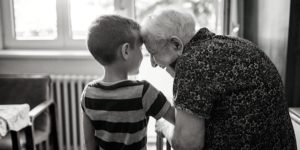 Grandmother and grandson hugging