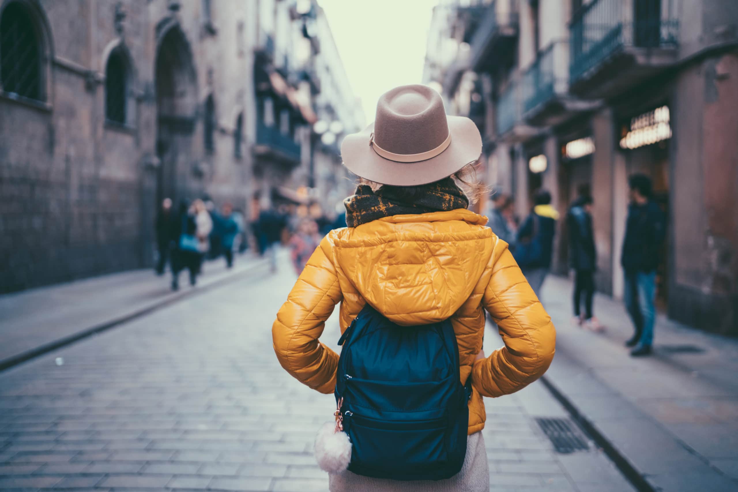 Rear view of young woman enjoying Barcelona