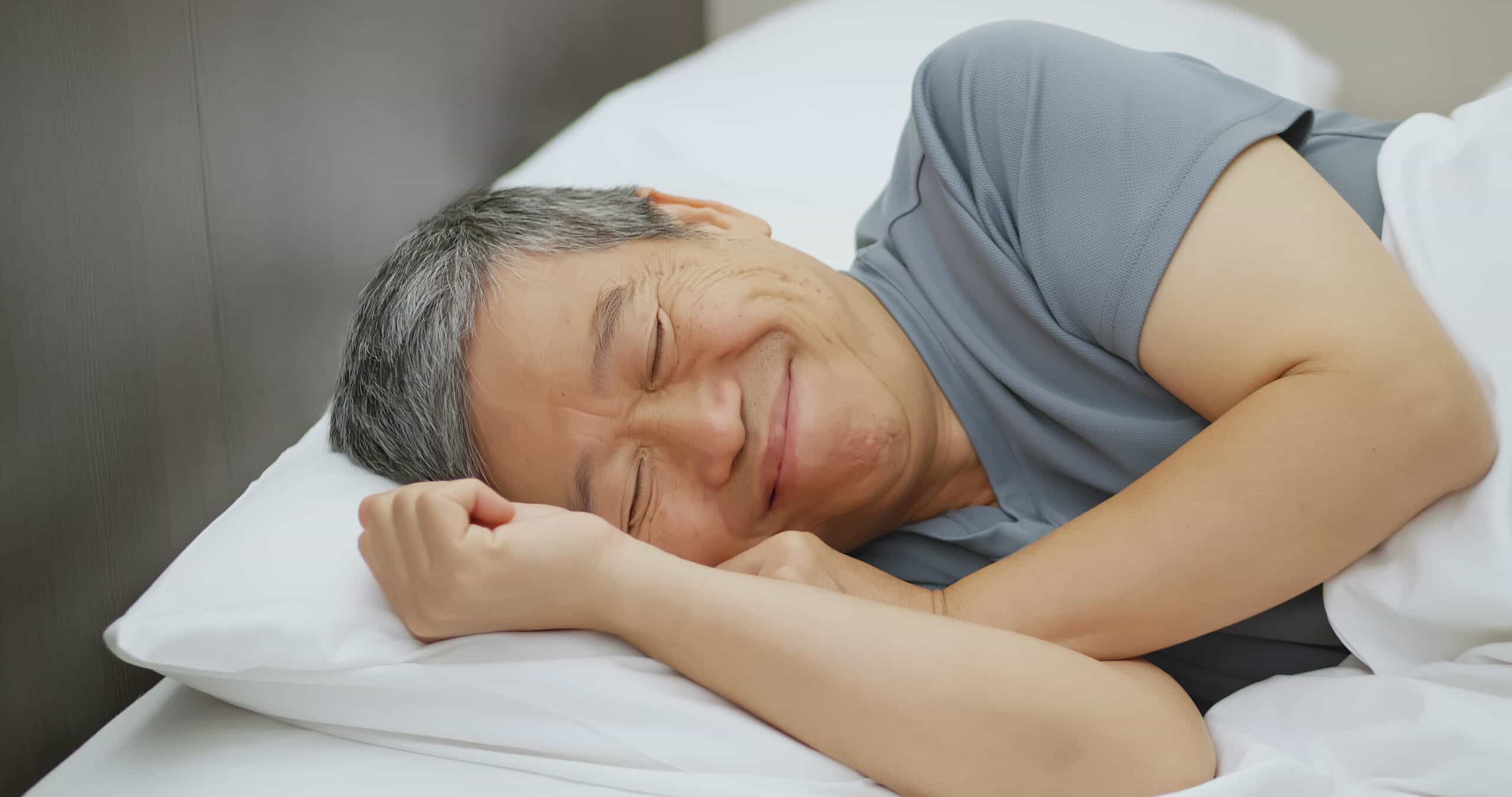 asian elder man have good dream when he sleep