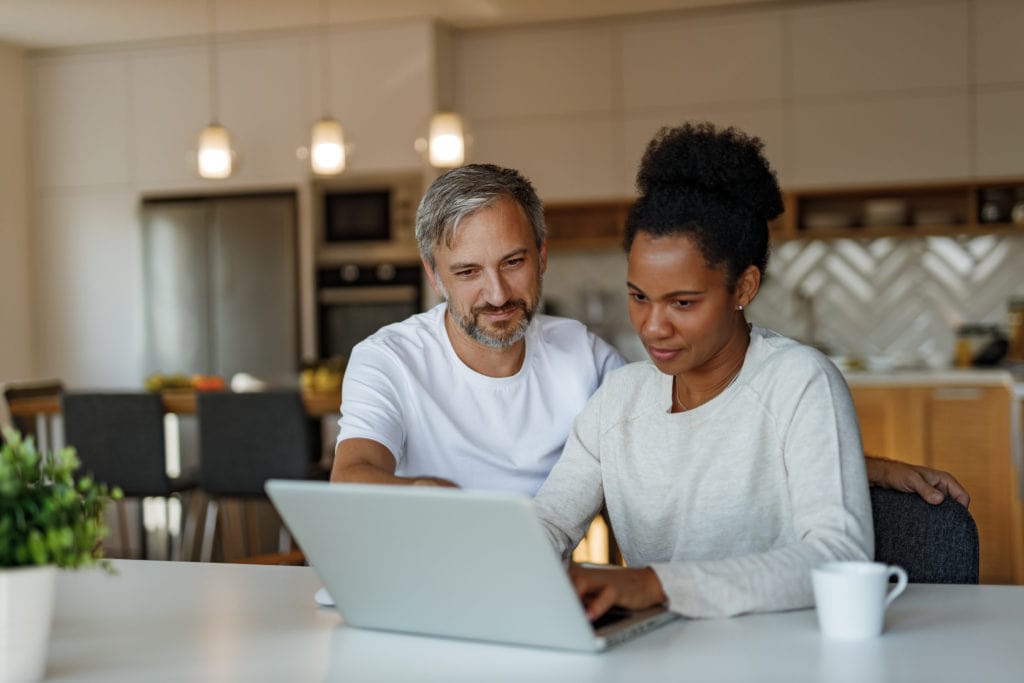 Man and woman searching something online.