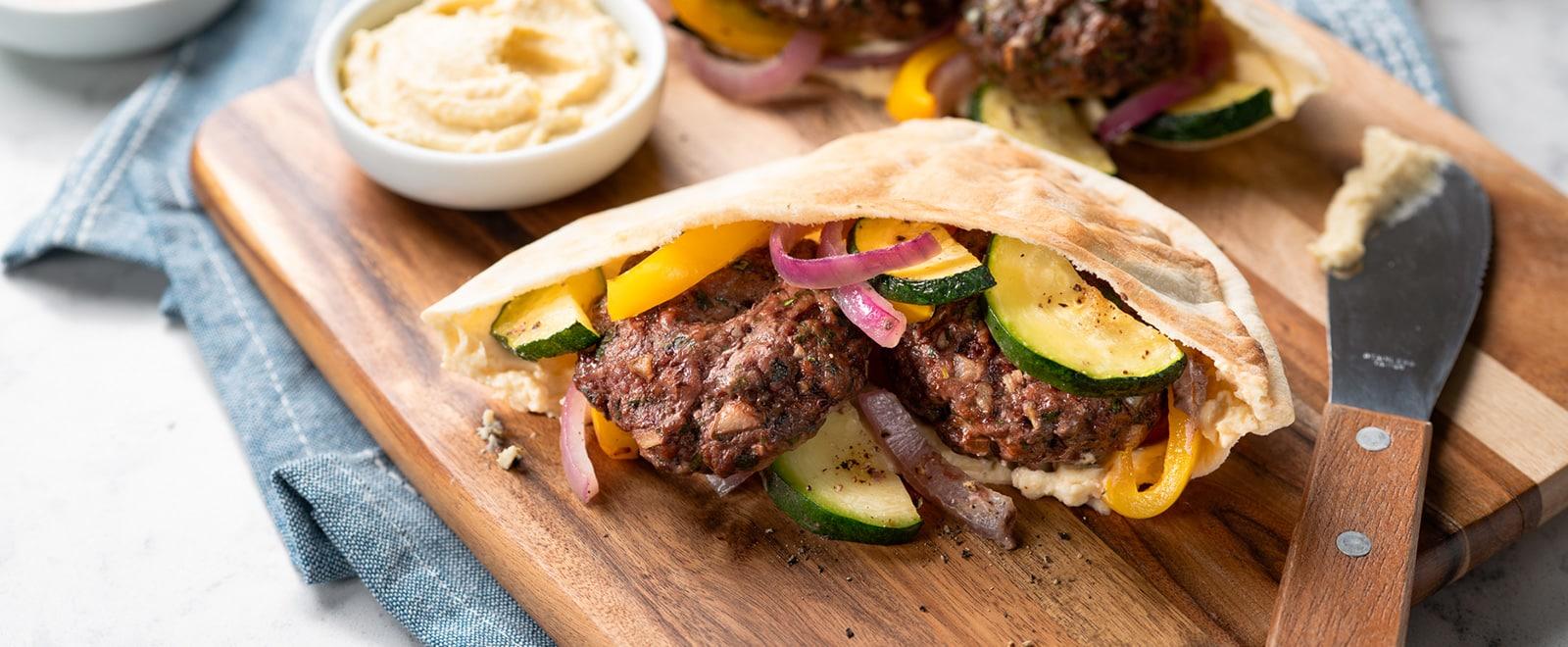 Herb Beef Patties and Veggie Sheet Pan Dinner Pitas