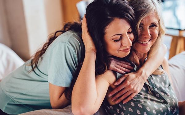 Two woman hugging 