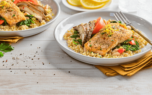 Salmon Lemony Greens Bulgar Bowl with Greens on a bowl with a fork