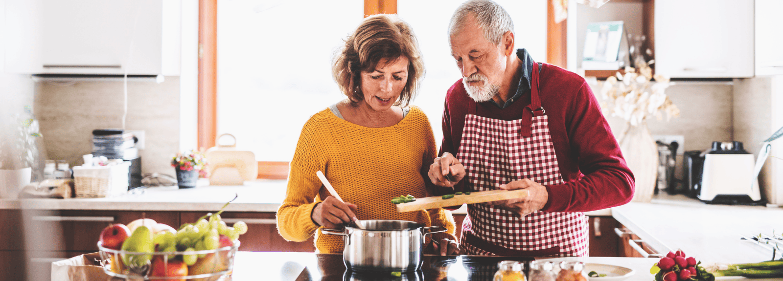 Man and woman cooking together